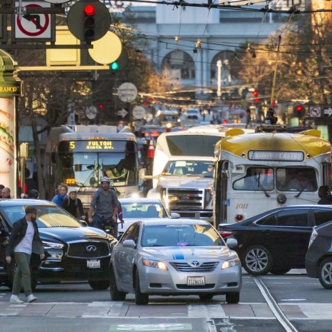 A TNC driving on Market Street
