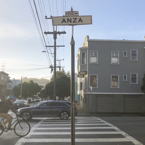 A bicyclist riding on Anza Street