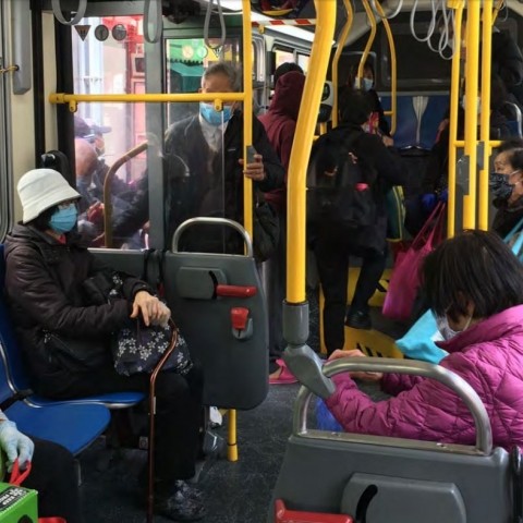 People riding a bus during shelter-in-place