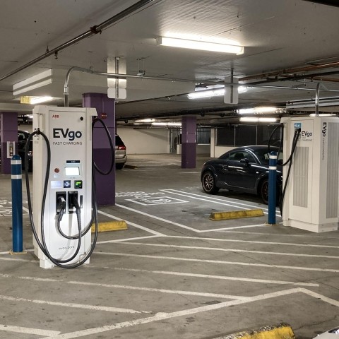 Electric vehicle charging stations in a parking garage 