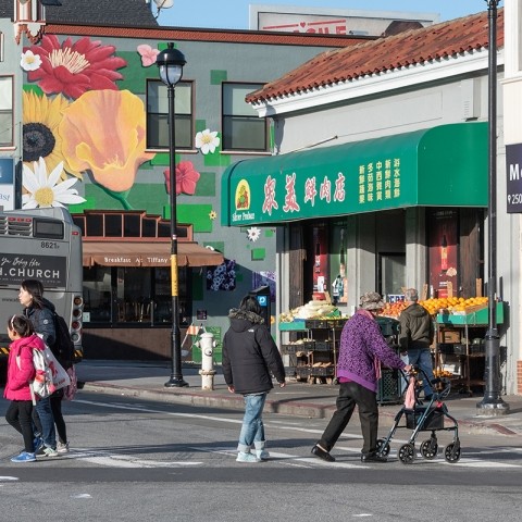 People crossing the street on San Bruno Ave in San Francisco