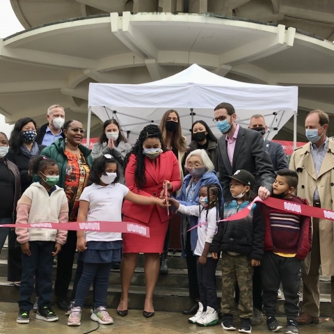 City officials, transportation agency staff, and community members gathered around the ribbon cutting in front of the Japantown Peace Plaza.