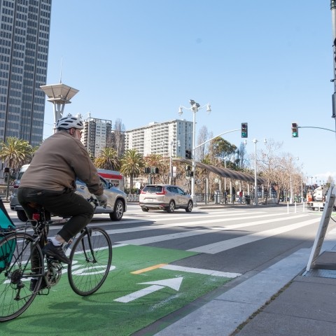 Person on biking on bike lane along Embarcadero