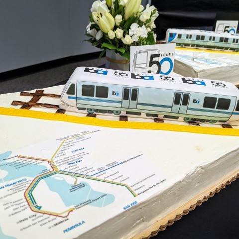 Two BART cakes with maps and 3-D trains