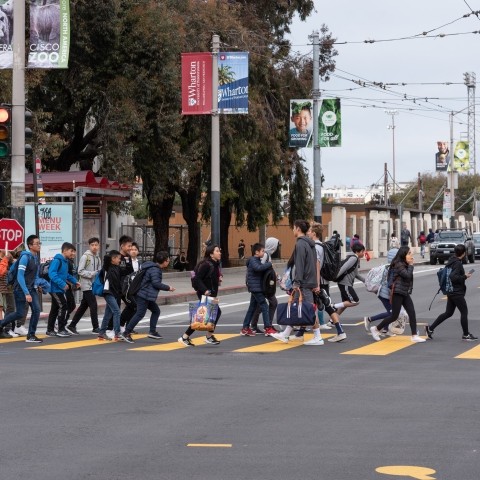 Kids crossing street on crosswalk