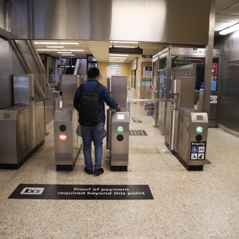 BART rider going through updated faregate. 