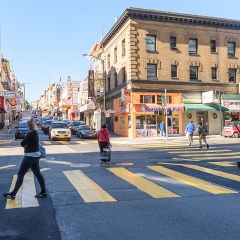 Pedestrians crossing in pedestrian scramble in Chinatown at Kearny and Jackson Streets