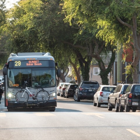 29 Sunset bus at Persia and Moscow, with passengers boarding at the front of the bus