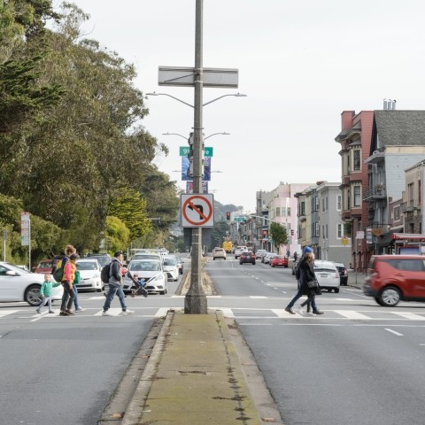 Pedestrians crossing in crosswalk along Lincoln Avenue