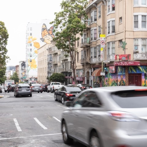 A blurred vehicle in motion driving through Hyde Street