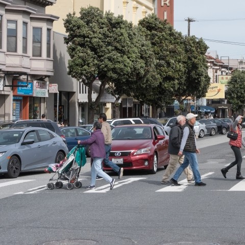 Group of pedestrians crossing Geary Street