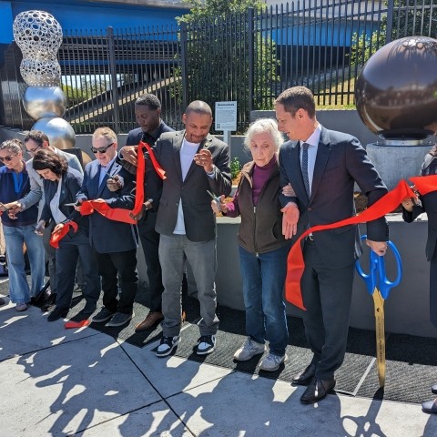 D10 Supervisor Shamann Walton, Mayor Daniel Lurie, SFCTA Director Tilly Chang, and community members cutting a ribbon at the Potrero Gateway