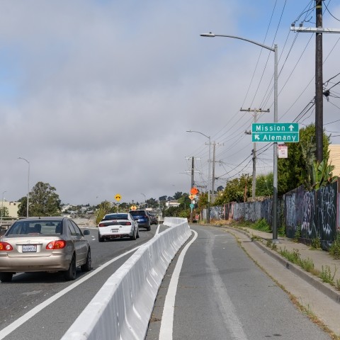 Protected bikeway barrier along Alemany Blvd