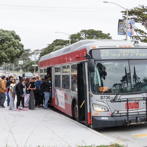 Students waiting to board 29 Sunset Muni bus along Sunset Blvd