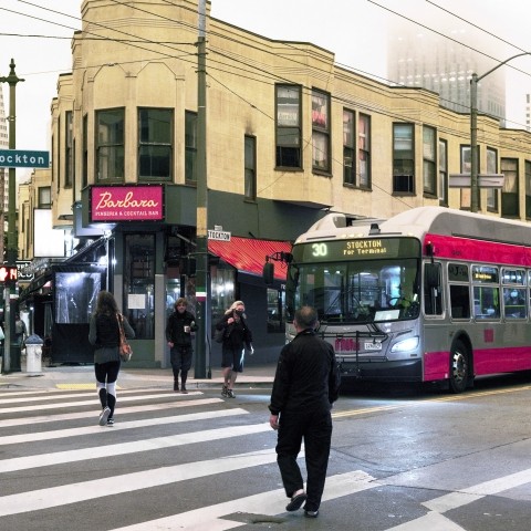 Pedestrians crossing at the intersection at Columbus, Green, and Stockton