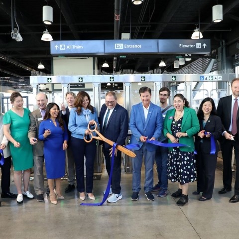 Transportation officials and leaders cutting a ribbon