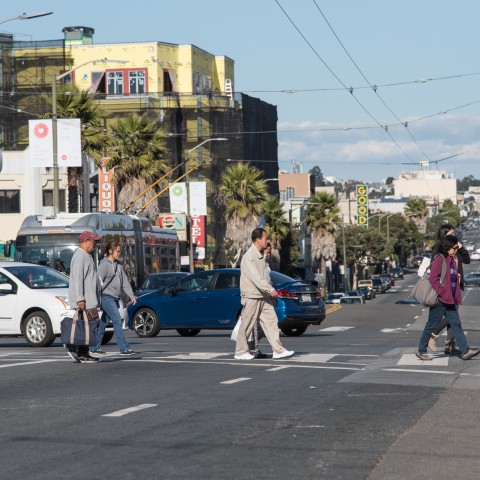 Pedestrians crossing the street on Mission Street 