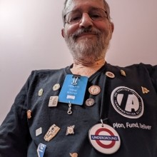 Former Transportation Authority Community Advisory Committee member, Peter Tannen, pictured wearing shirt with transit pins