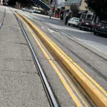 Raised cement curb in center of road