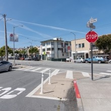 Pedestrian safety zone with posts around the curb of an intersection