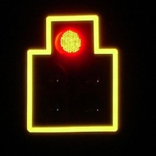 Reflective material around a traffic signal head