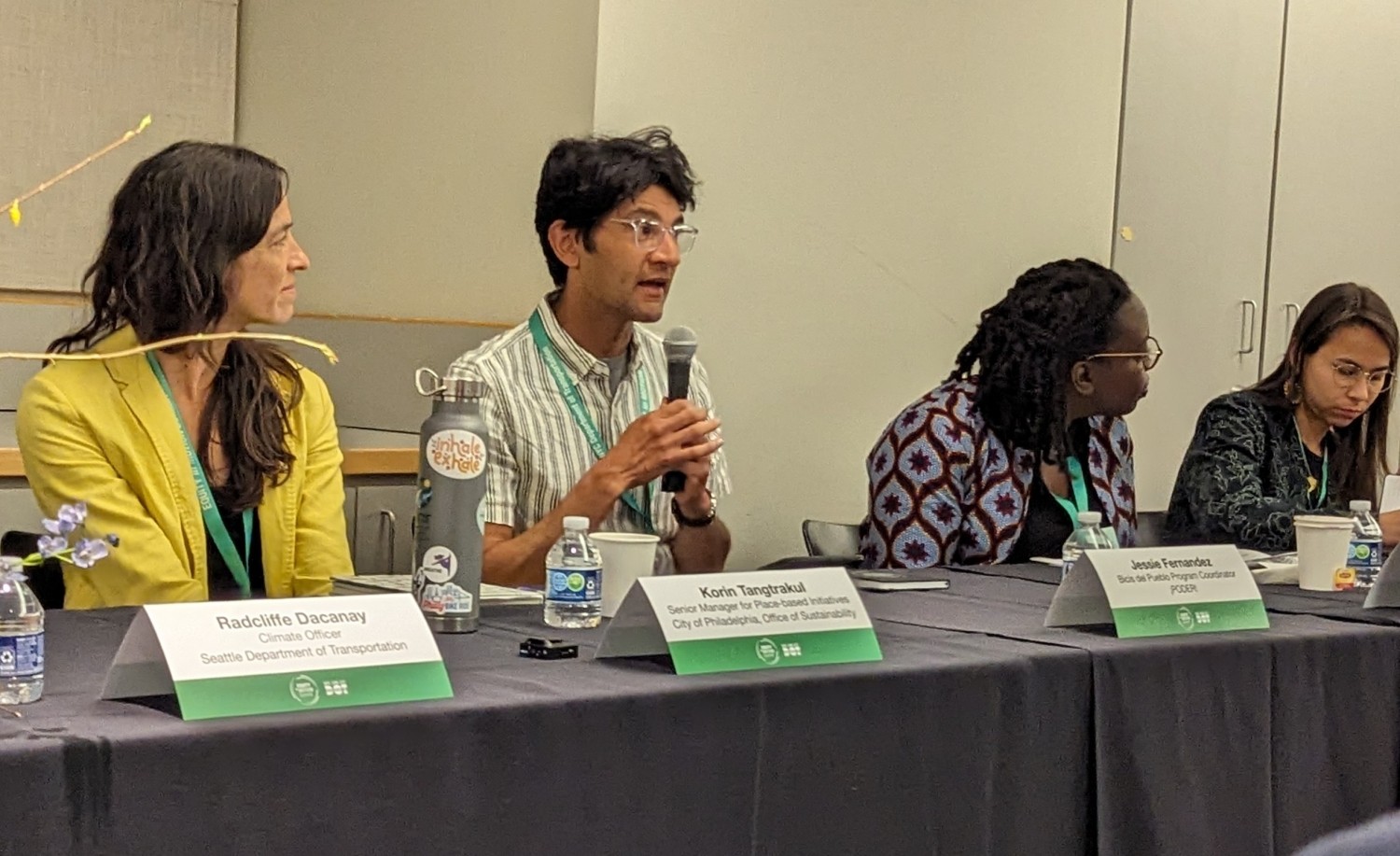 Staff from PODER speaking on a panel